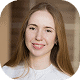 A diverse professional woman working on creative projects in a modern workspace, representing versatility and expertise in multiple fields.